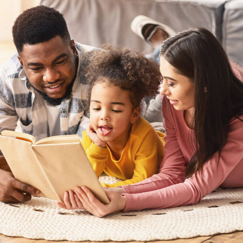 Dad-and-Mom-reading-to-child