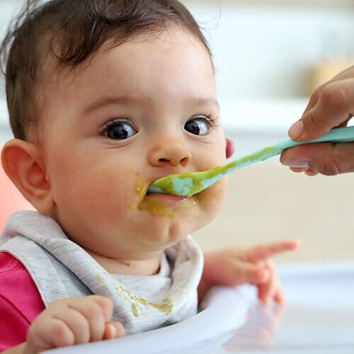 Spoon-feeding-little-girl
