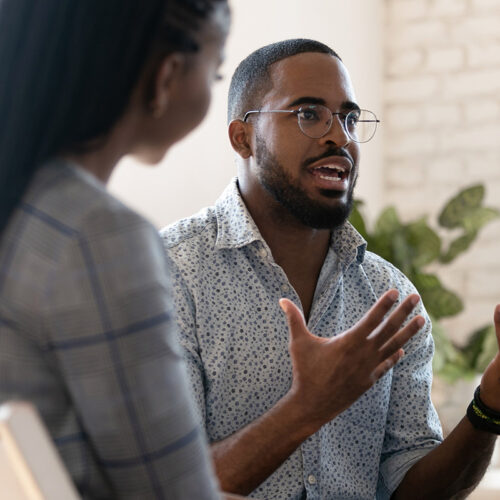 man talking with group